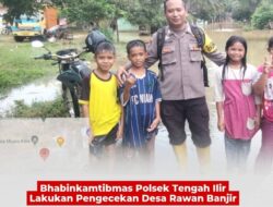 Bhabinkamtibmas Polsek Tengah Ilir Lakukan Pengecekan  Desa Rawan Banjir